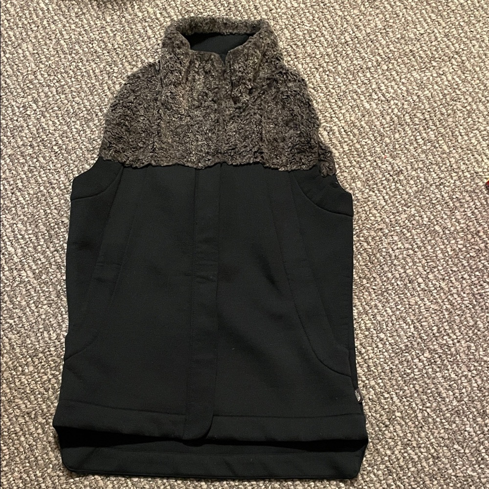 The North Face women’s green vest with faux fur trim
